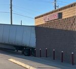 Semi Rolls Across 2 Chadron Streets, Hits Truck And Car Wash